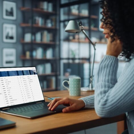 Woman searching the Order portal on her laptop.