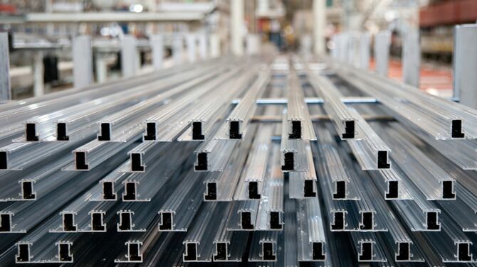Aluminium profiles neatly stacked.