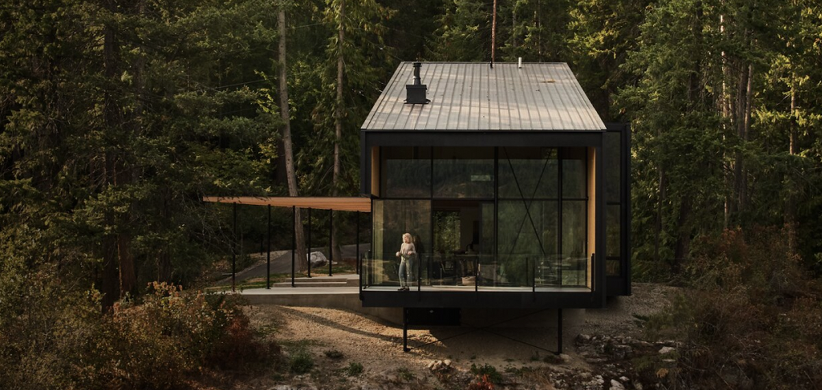 Summer Cabin on a rocky terrain with generous outdoor patios