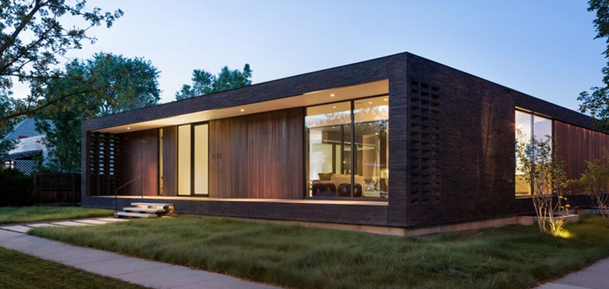 Night time view of American contemporary Brick City House.
