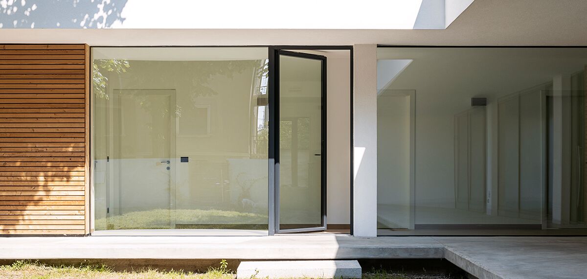 Open glass door in a modern private home.