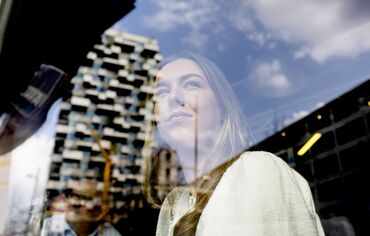 girl looking out of a window